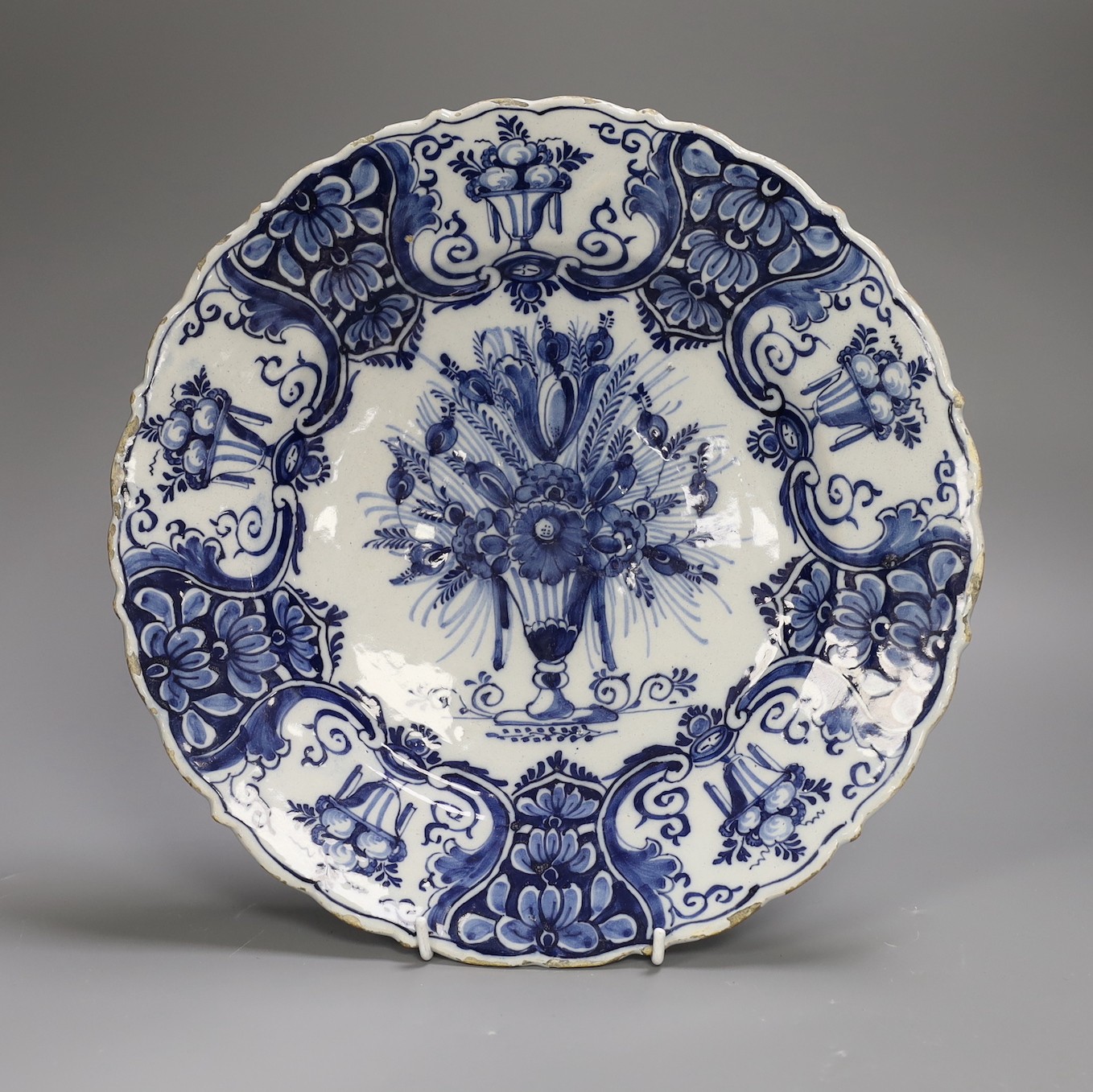 A mid 18th century Delft blue and white ‘flower urn’ dish, Claw Factory, 31cm